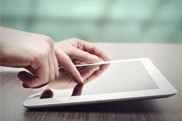 hands and tablet computer