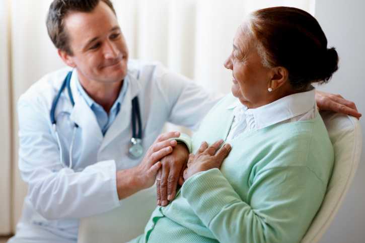 A woman speaking with her health care provider.