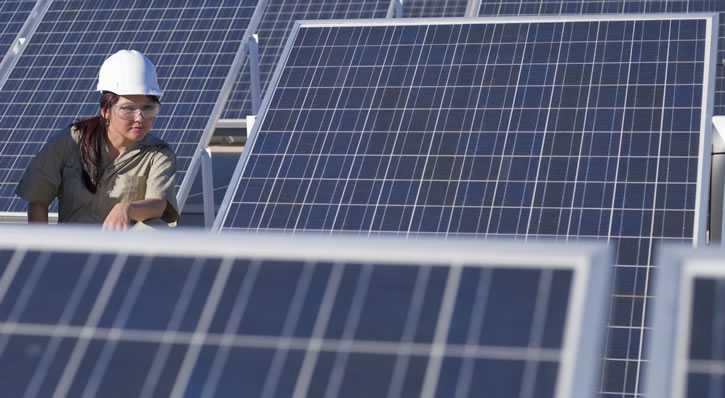 woman working with solar panels