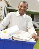 Man carrying recycling bin