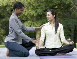 Two women doing yoga