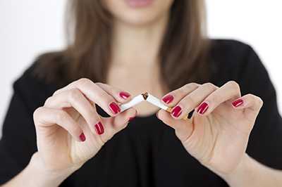 Picture of a person breaking a cigarette