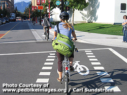 Woman riding in a bike lane