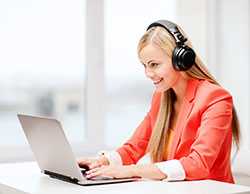 Woman with headphones and laptop