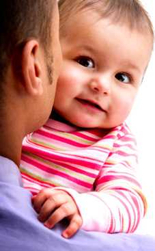 baby in dad's arms