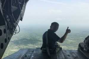 While in Liberia, John helped transition U.S. Army and U.S. Department of Defense laboratories to U.S. government partner organizations. (left: on the back of a U.S. Army Chinook helicopter; right: in Tapita, Liberia)