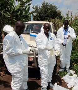 Three men wearing protective clothing