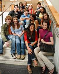 teenagers sitting on stairs at school