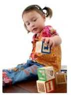 Little girl playing with blocks